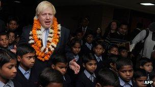 Mr Johnson with schoolchildren at Amity University