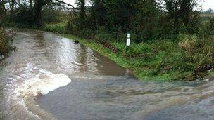 Water flowing on to Dunstall Lane in Hopwas