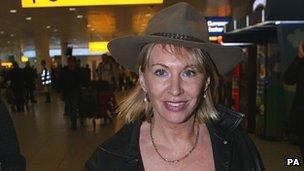 Nadine Dorries arrives at Heathrow