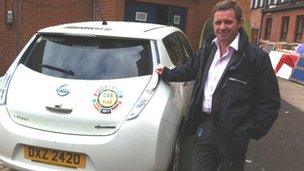 Conor Macauley with the e-car