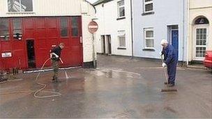 Residents clean-up after the village of Millbrook was flooded