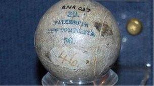 A gutta percha golf ball held at The Royal and Ancient Golf Club