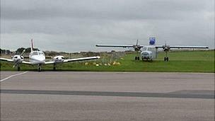 Alderney Airport: planes parked on grass