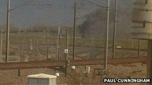 Smoke pours from a freight train near the French end of the Channel Tunnel (photo: RTE correspondent Paul Cunningham)