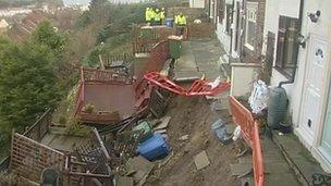 Workers at landslip houses