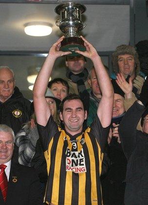 Crossmaglen Rangers captain David McKenna lifts the cup after the final