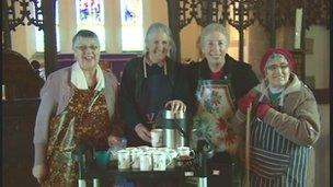 Protesters wearing aprons to demonstrate against the Church of England's decision to reject women bishops