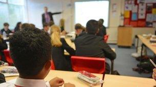 Teacher at board in classroom