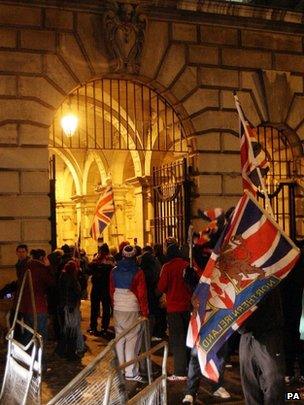 Loyalist protesters forced their way through the back gate of the City Hall