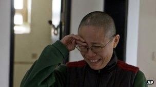 Liu Xia, wife of 2010 Nobel Peace Prize winner Liu Xiaobo, reacts emotionally to an unexpected visit by journalists at her home in Beijing, China, 6 December 2012