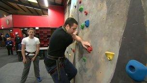 Young people on a climbing wall