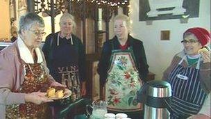 Protesters wearing aprons to demonstrate against the Church of England's decision to reject women bishops