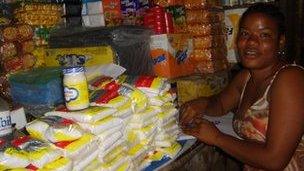 A female market trader with her goods