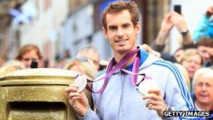 Andy Murray with a gold post box in Dunblane