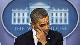 President Obama wipes away a tear while he talks about the Sandy Hook School shooting