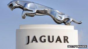 A Jaguar sign stands at a Jaguar dealership in the USA