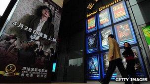 Cinemagoers arrive at Wanda International Cinemas in Beijing