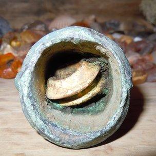 Gold rings in a bronze age axe head