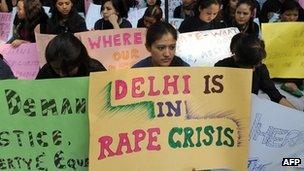 Women from India"s North Eastern states hold placards during a peaceful protest against the rape of a girl from Mizoram, in New Delhi on November 29, 2010.