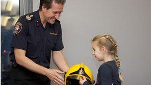 Abi being presented Mr Bannon's helmet