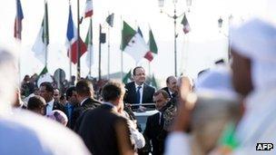 Crowds surround Francois Hollande's motorcade on Wednesday