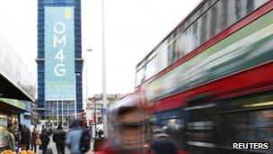 Woman walks past 4G advert