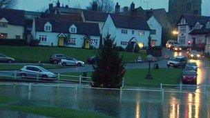 Christmas tree in flood water in Finchingfield, Essex