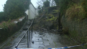 About 30 tons of rubble and soil falling on to a footpath in Swansea