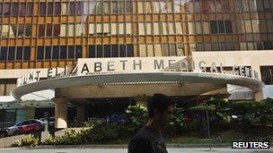 A man walks past the Mount Elizabeth Medical Centre where Indian gang-rape victim will undergo treatment in Singapore December 27, 2012