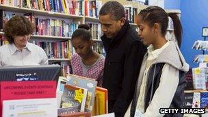 President Barack Obama and daughters Sasha and Malia at a book shop on America's Small Business Saturday