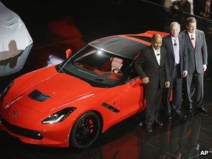 From left, General Motors vice president of global design, Ed Welburn, chief Corvette engineer Tadge Juechter and president of General Motors North America, Mark Reuss stand next to the redesigned Corvette Stingray, Sunday, 13 Jan, 2013