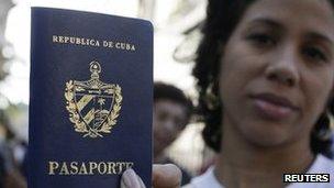 Cuban woman shows her new passport