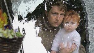 Michael Bower with his daughter after the attack on his house