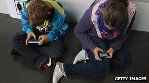 Children using mobile phones