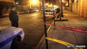 Police cord across a street where a shooting has occurred in Chicago, Illinois 8 January 2013