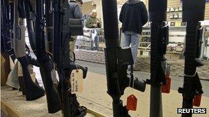 Customers shop at the Guns-R-Us gun shop in Phoenix, Arizona, 20 December 2012