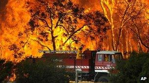 A fire engine moves away from a bushfire in the Bunyip Sate Forest near the township of Tonimbuk (7 February 2009)