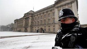 A Metropolitan Police officer on duty outside Buckingham Palace in central London