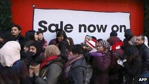 Shoppers queuing outside a shop in central London on Boxing Day