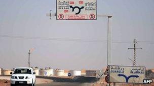 A car drives past the gas plant on the outskirts of In Amenas, in Algeria, where militants took dozens of foreign workers hostage (18 January 2013).