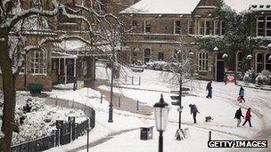 People walking through snow in Buxton