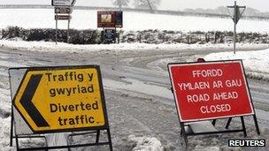 Temporary signs stand on the A4075 road near Martletwy, closed due to heavy snowfalls