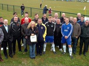 Paula Lunt presents the FA with their defibrillators