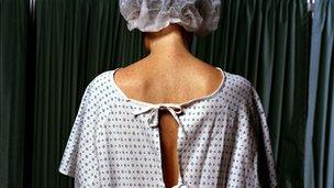 Patient wears a hospital gown