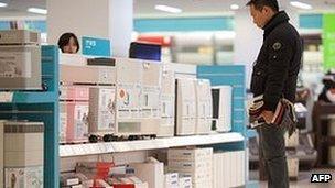 A man shops for air purifiers in Beijing on January 15, 2013