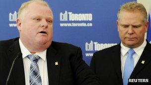 Toronto Mayor Rob Ford speaks to the media at City Hall supported by his brother, Councillor Doug Ford after winning his conflict of interest appeal in Toronto, Ontario, 25 January 2013