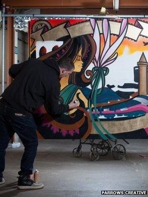 Inkie at work on his piece 'Bristol to Brooklyn'