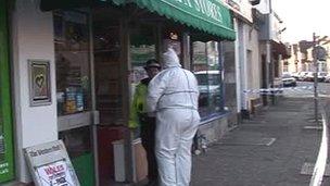 Police at the shop in Cathays