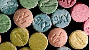 Multi-coloured ecstasy pills marked with various logos