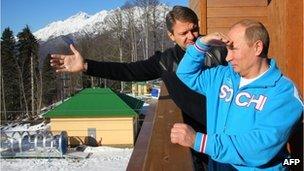 Russian President Vladimir Putin (R) speaks with Alexander Tkachev (L), Krasnodar region Governor, during a visit to the mountain resort in Krasnaya Polyana outside the Russian Black Sea resort of Sochi